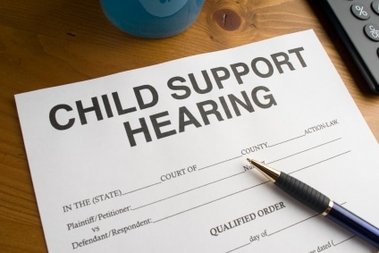 Child support hearing paperwork with pen